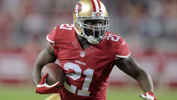 Dec 20, 2014; Santa Clara, CA, USA; San Francisco 49ers running back Frank Gore (21) carries the ball against the San Diego Chargers at Levi’s Stadium. Mandatory Credit: Kirby Lee-USA TODAY Sports
